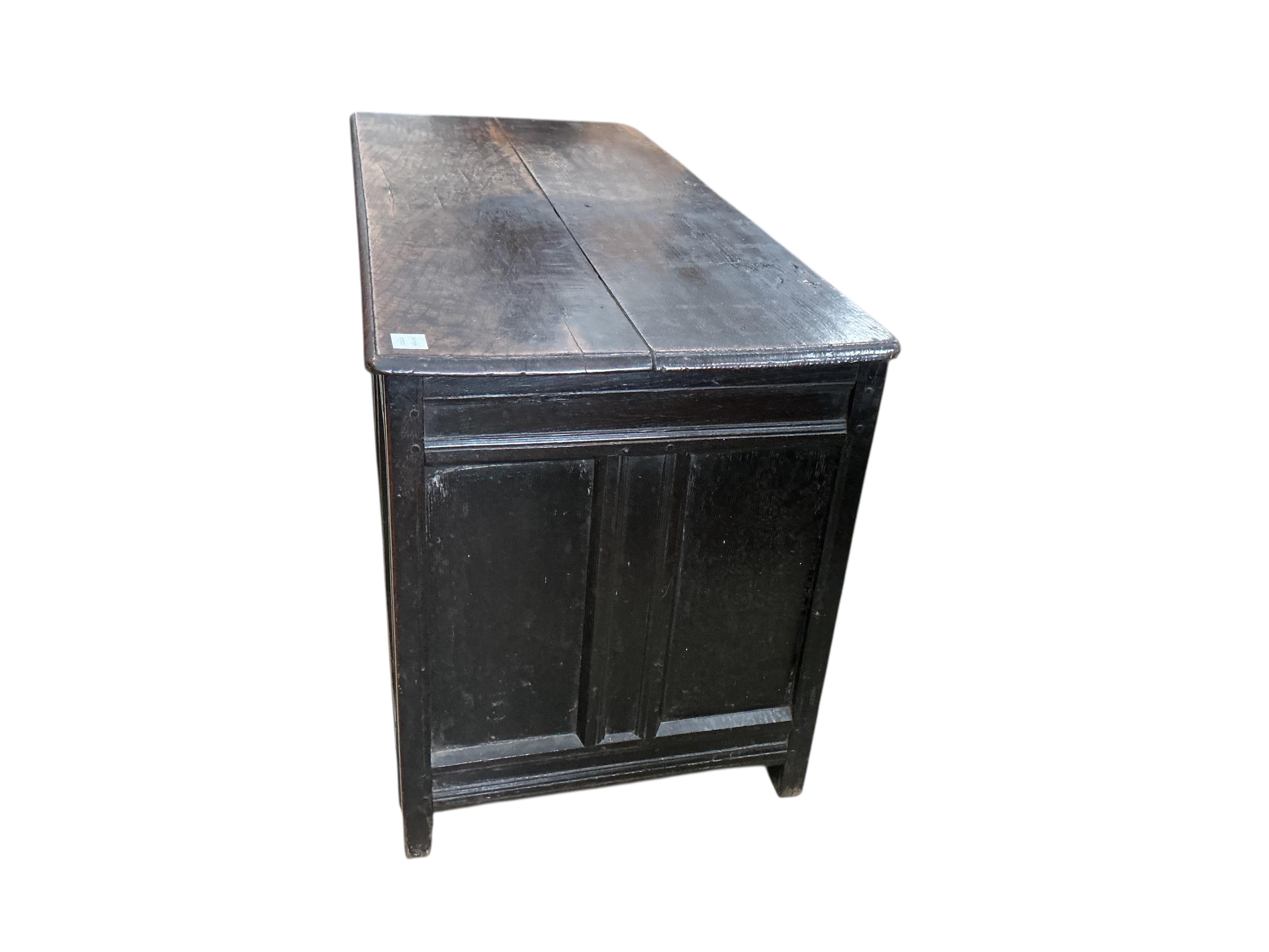 An early 18th century panelled oak coffer, width 120cm, depth 54cm, height 66cm